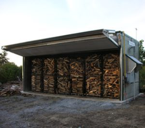 Large steel firewood box kiln with the door open